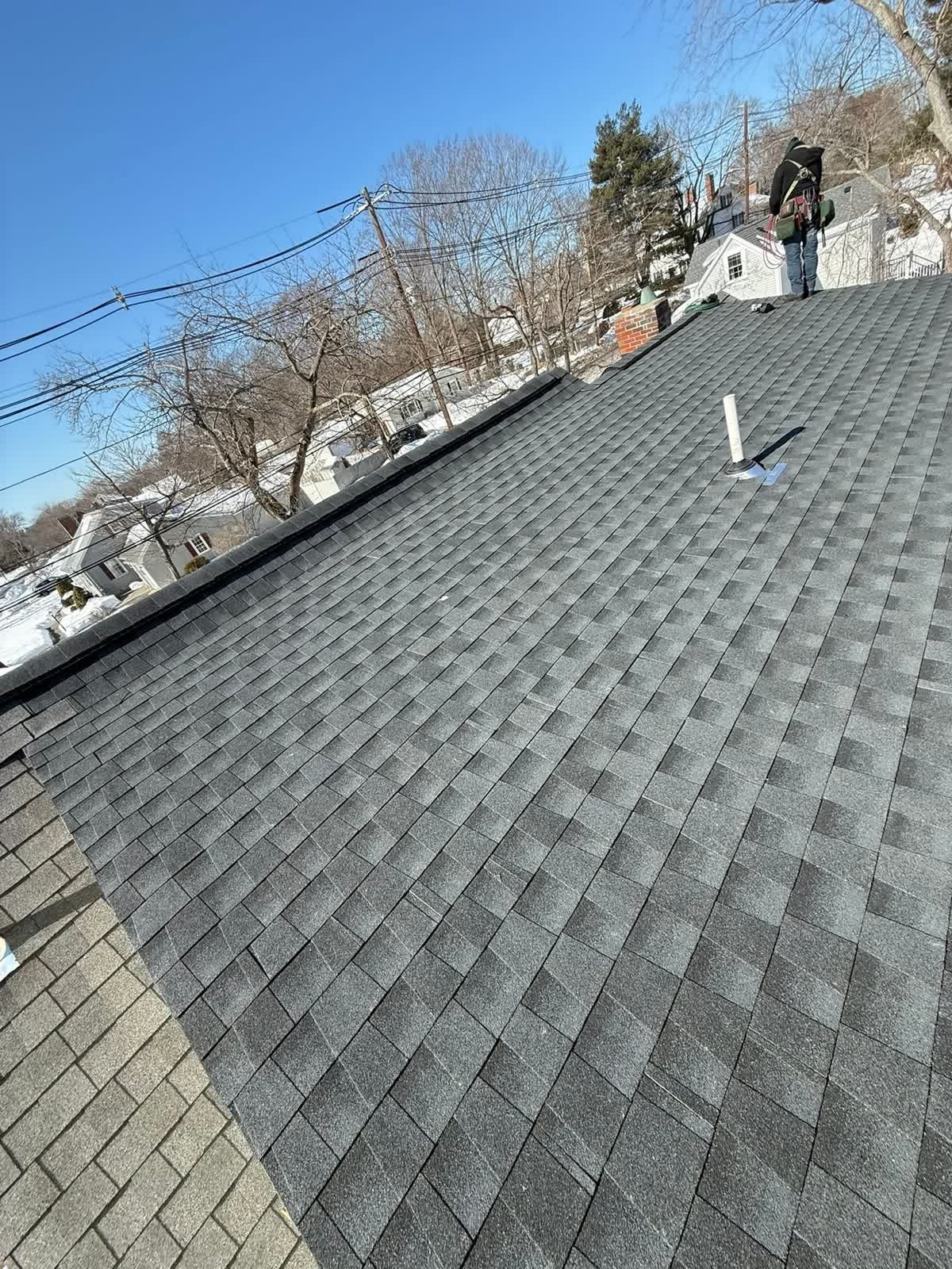 Our crew finishing a roof replacement